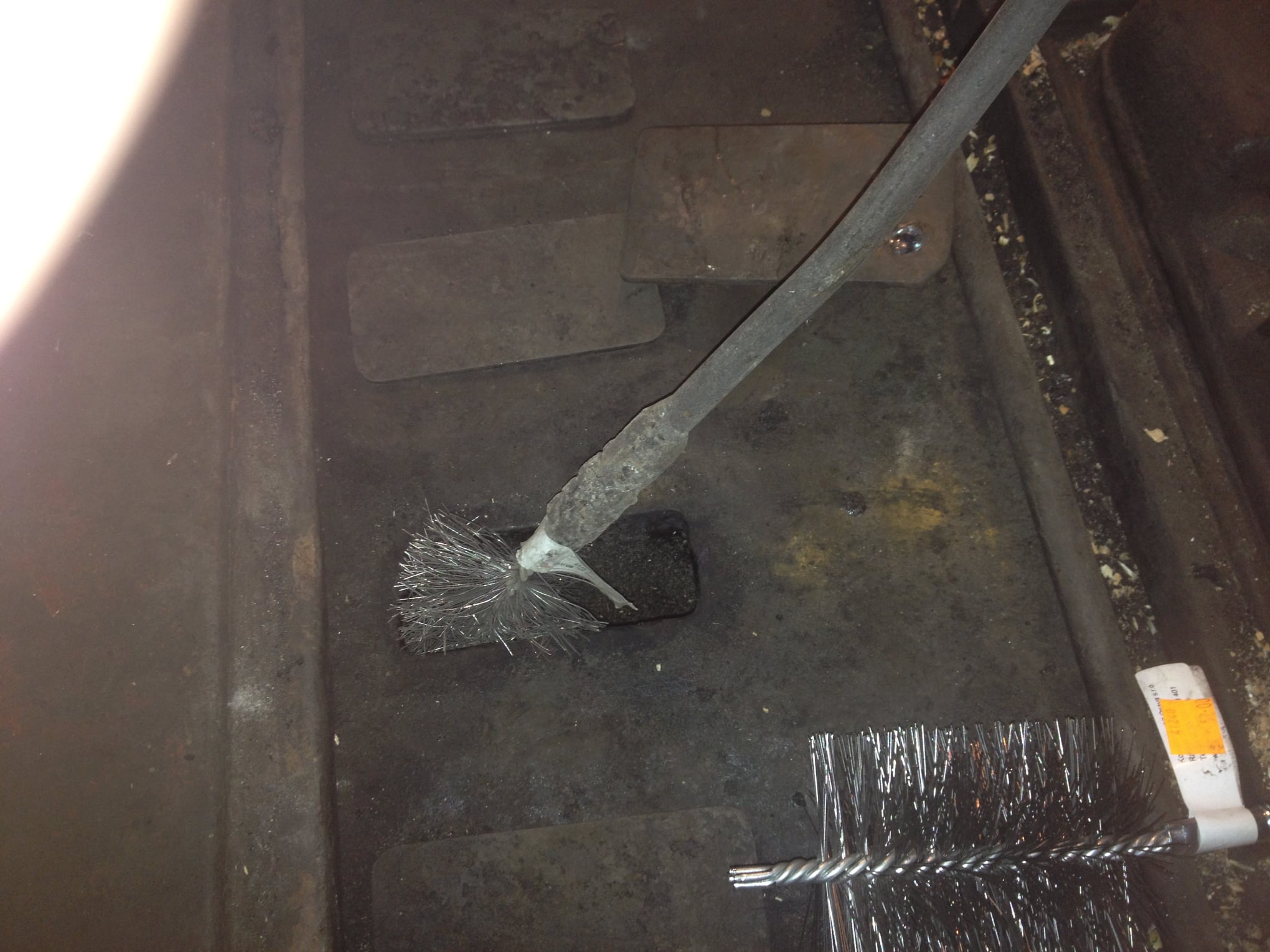 handyman brno - Handyman in Brno cleaning a solid fuel boiler from soot and creosote